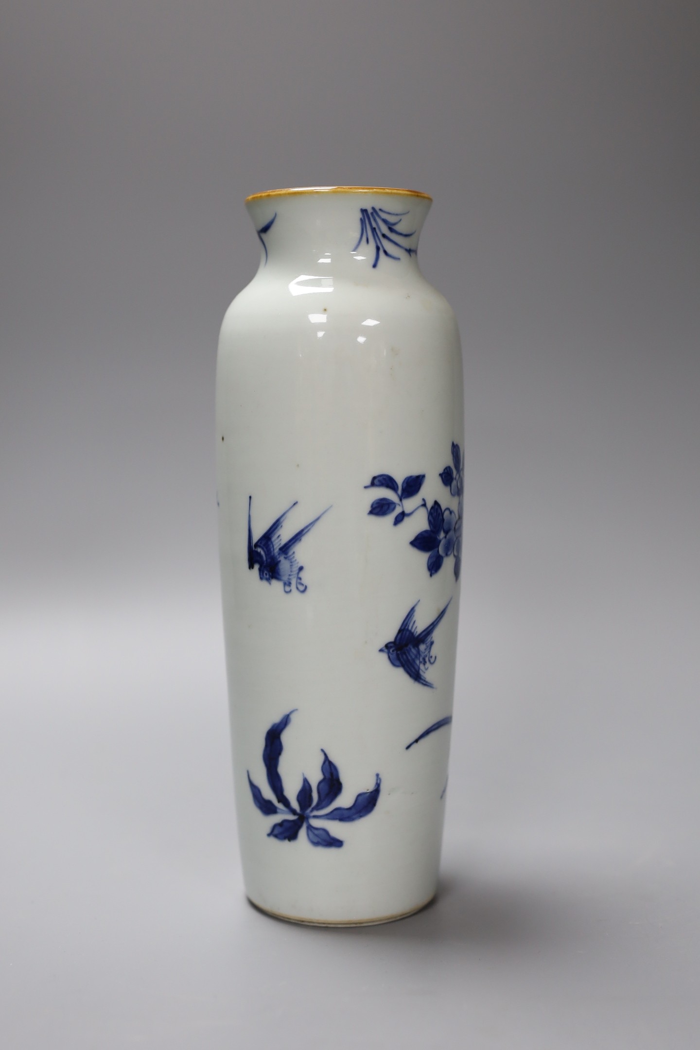 A Chinese blue and white vase decorated with flowers and birds, 21.5cm